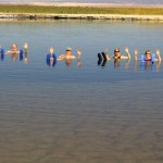 Left to right, Tom, Harry, Mollie and Jan enjoying the saltwater lake with hands and croc-shod feet in the air!.